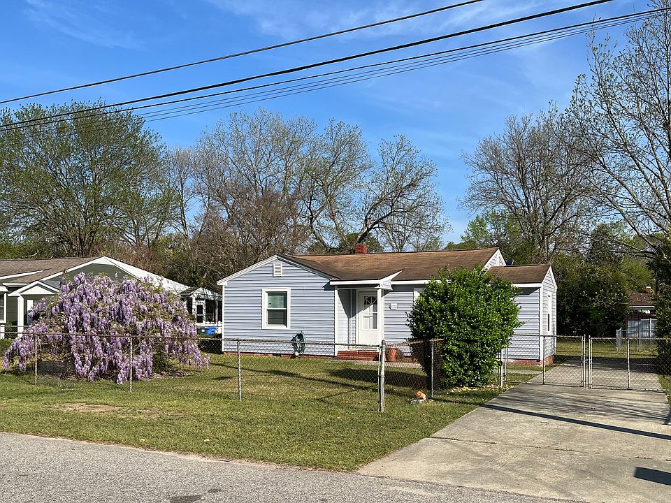 Front View (taken from across the street) - private driveway that fits two cars/trucks comfortably. Off-street parking available in front of the fence.