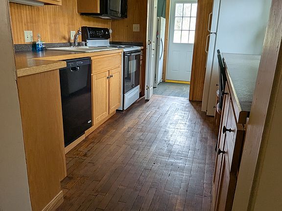 galley kitchen with bar seating