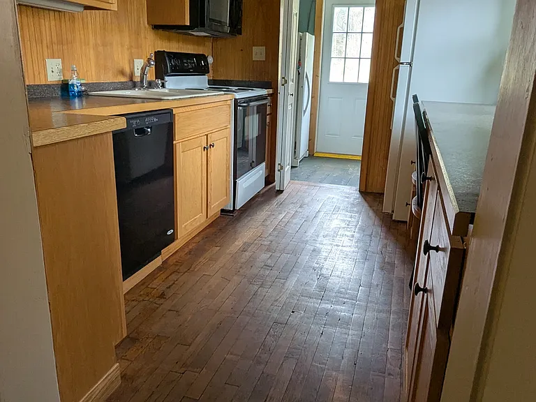 galley kitchen with bar seating