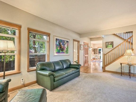 Spacious formal living room with gorgeous fir framed windows.