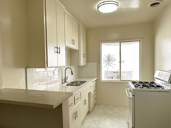 Kitchen with quartz counter top and gas stove