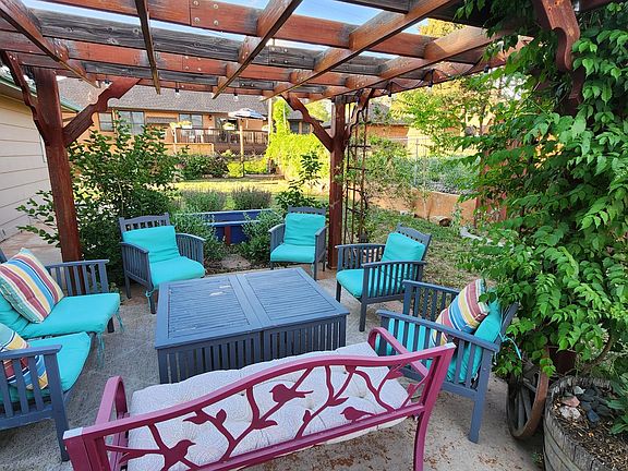Arbor and patio area are great for hosting friends and family