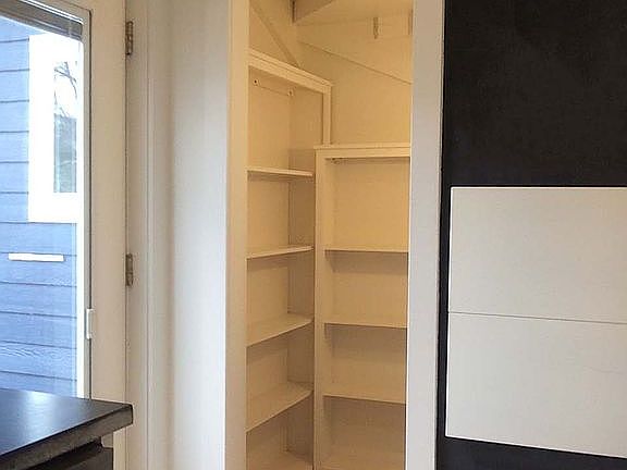 Walk-in pantry under stairs