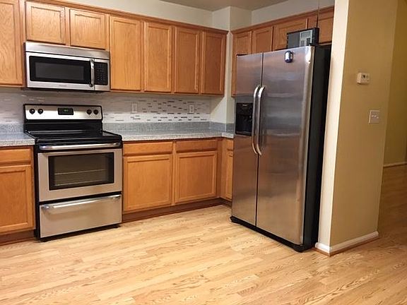 Kitchen with Granite Counter Top and Stainless Steel Appliances.