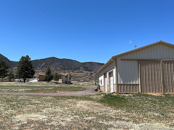 House and barn with mountain