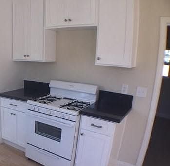 Kitchen with brand-new quartz counter tops & soft closing ca