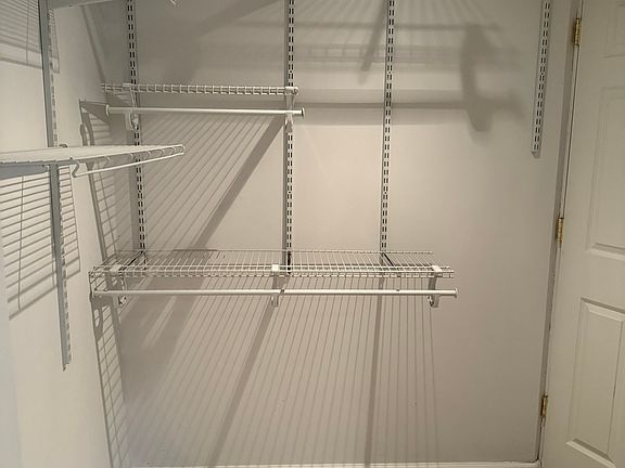Large walk-in closet in bedroom.