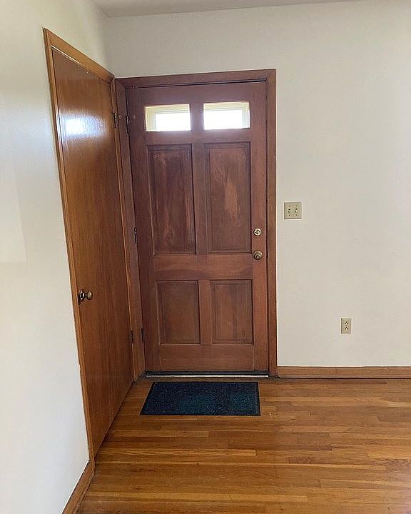 Living room front door, gorgeous hardwood floor, freshly painted