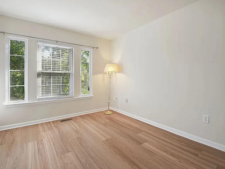 Overview of the primary bedroom on the upper level (walk-in closet not shown).