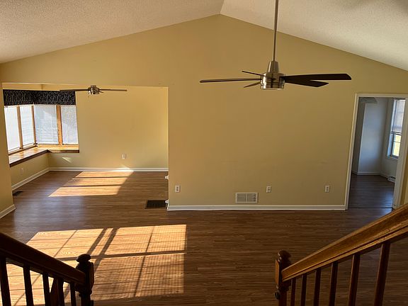 Main floor includes living room, dining room, kitchen, and breakfast area.