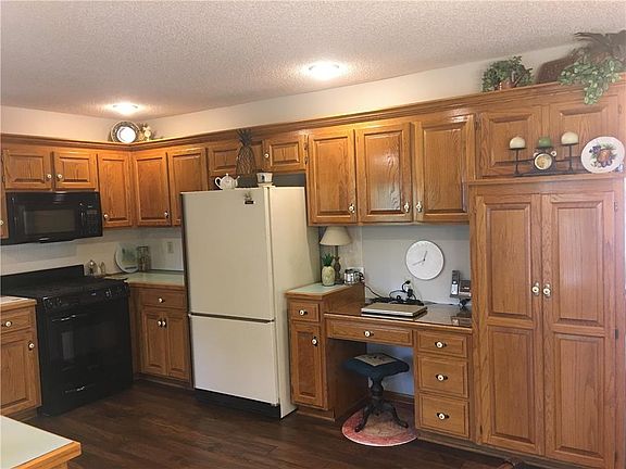 Kitchen cabinets and Large pantry are plentiful. Includes Gas stove with Microwave.