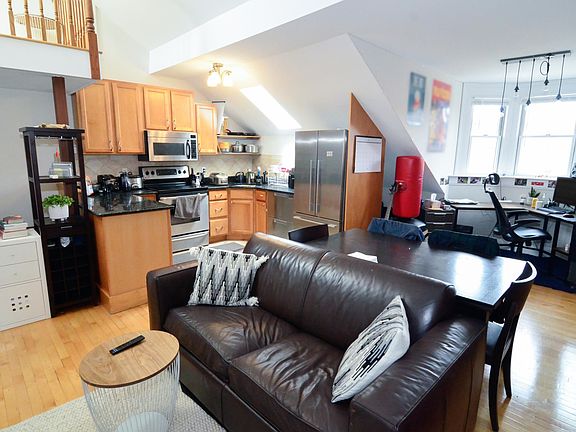Spacious living room with working fireplace