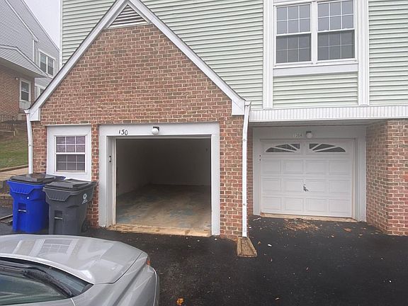 Parking garage and additional space for parking in front.