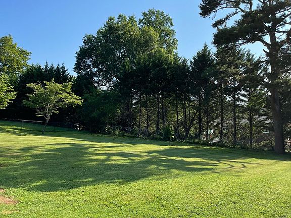 Huge level yard backs up to Forest Brook neighborhood.