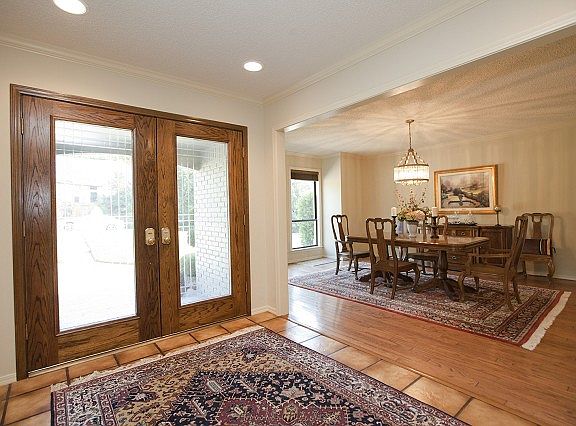 Double beveled glass front doors.