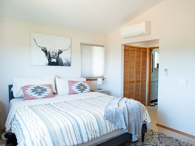 Primary bedroom, dual closets & bathroom