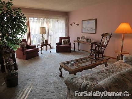 Living Room
						:
						Large wood sliding glass door to balcony