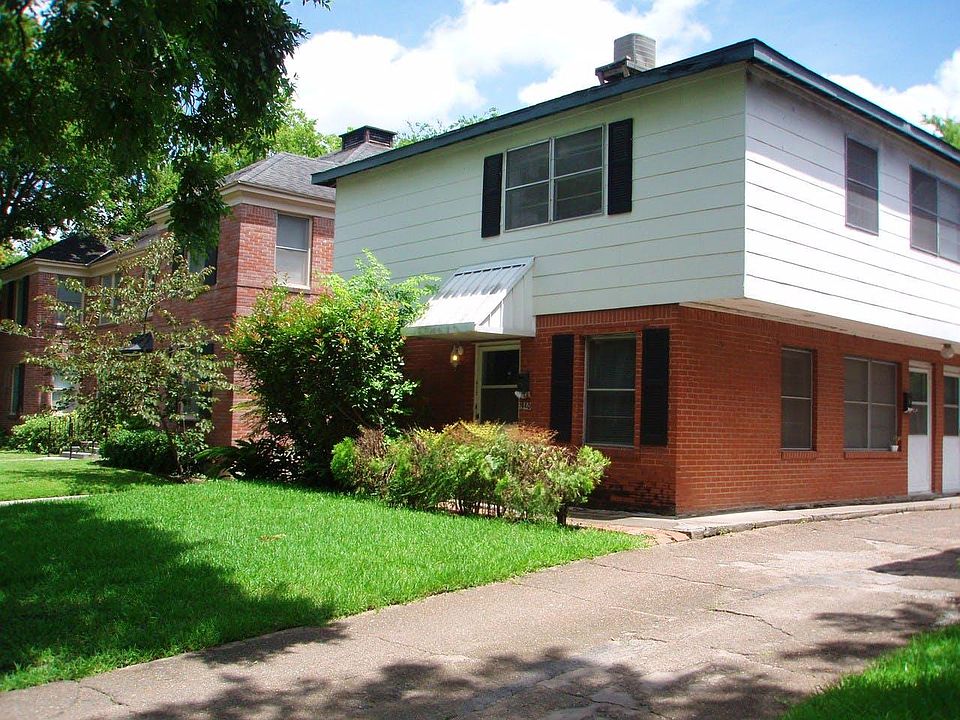 Townhomes at 1940 Dryden Road, Houston, TX 77030. Built in the 1950_s, they all have covered carport parking.