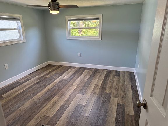 Master Bedroom with new double pane windows, ceiling fan for comfort and night shades to help you sleep.