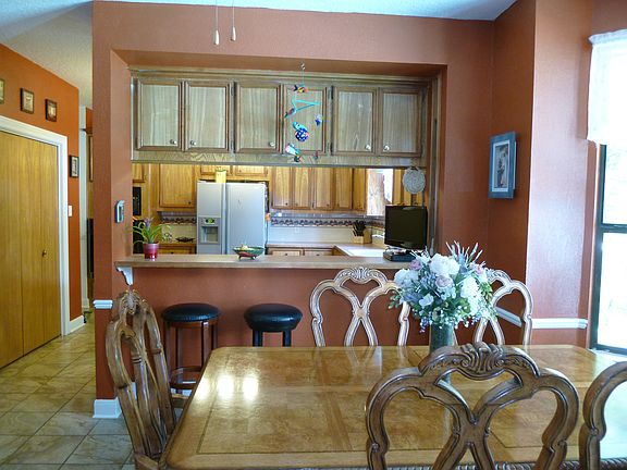 Dining area overlooks pool