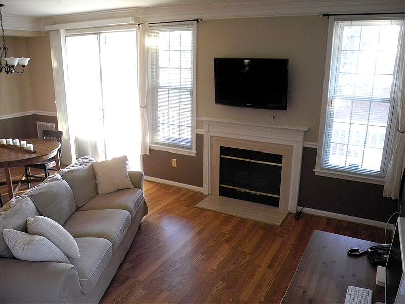 Living room - Wood floors, gas fire place, TV mount and hook
