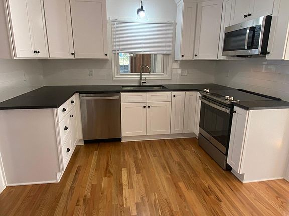 Brand new kitchen with new stainless steel appliances.