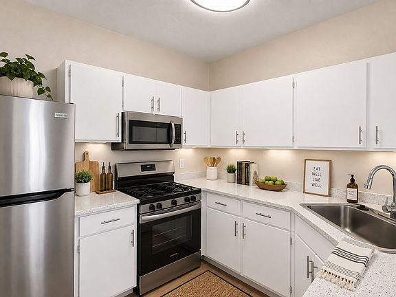Step into the inviting kitchen of Serena Shores, featuring modern stainless steel appliances, sleek countertops, and ample storage space. Perfect for culinary creations and gatherings. Schedule a visit today to see it for yourself!
