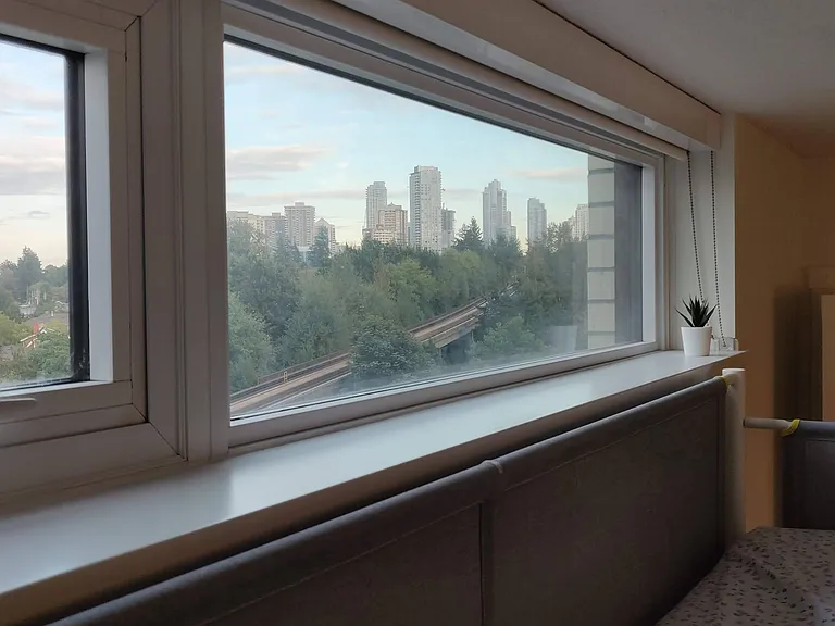 Window in 2nd bedroom overlooking the skytrain and metrotown (10 mins away)