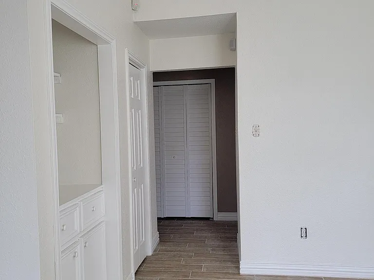 Living Room as it leads to hallway to bedrooms