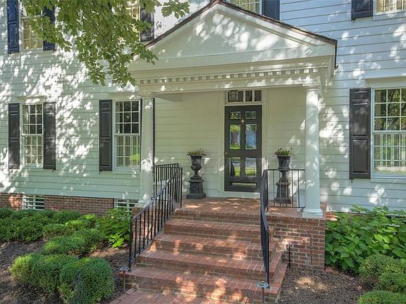 Hardie Board siding with 50 yr warranty (2007)! New laid brick from in 2018! A front entrance can not get any more charming than this!