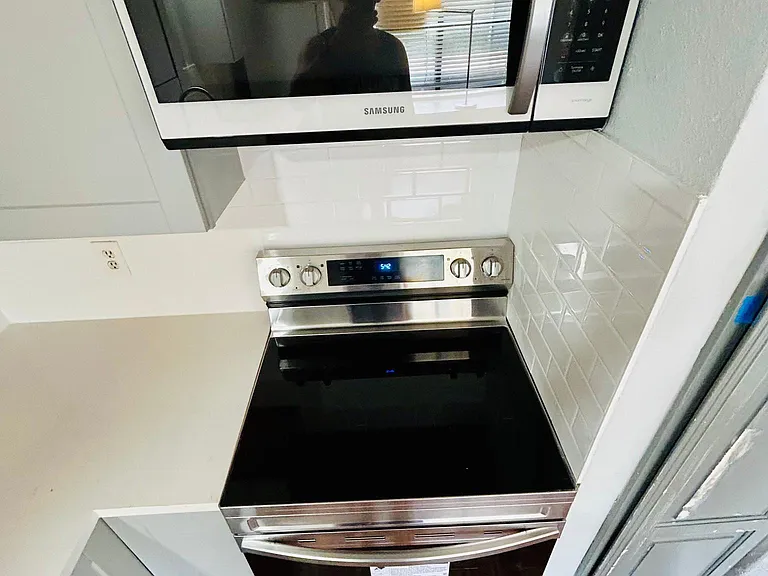 New Carrera Quartz countertops, new backsplash, new appliances