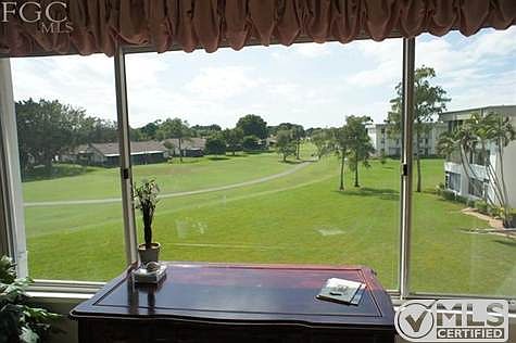 Wonderful distant view of 3rd fairway for the golf course from large picture window!
