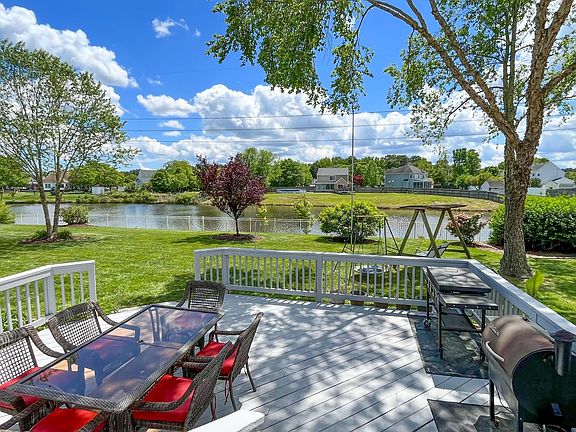 Beautiful backyard adjoins a private pond
