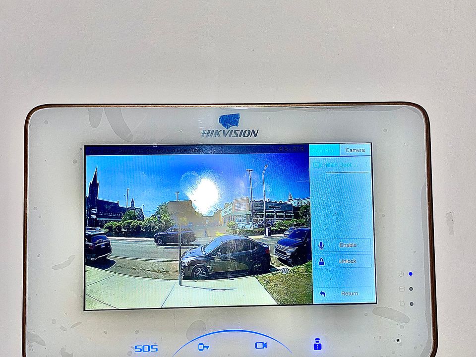 Screen to see who is at the door outside of the building