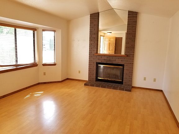 Living room with wood burning fireplace