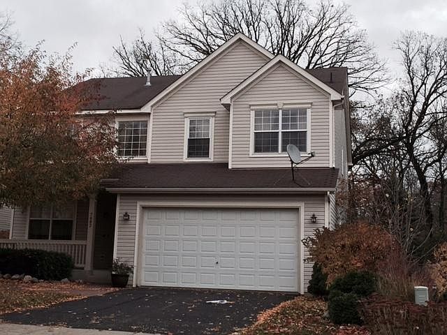 Front with charming porch - room enough for 2 good size chairs