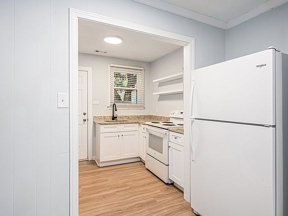 Kitchen with refrigerator, stove/oven