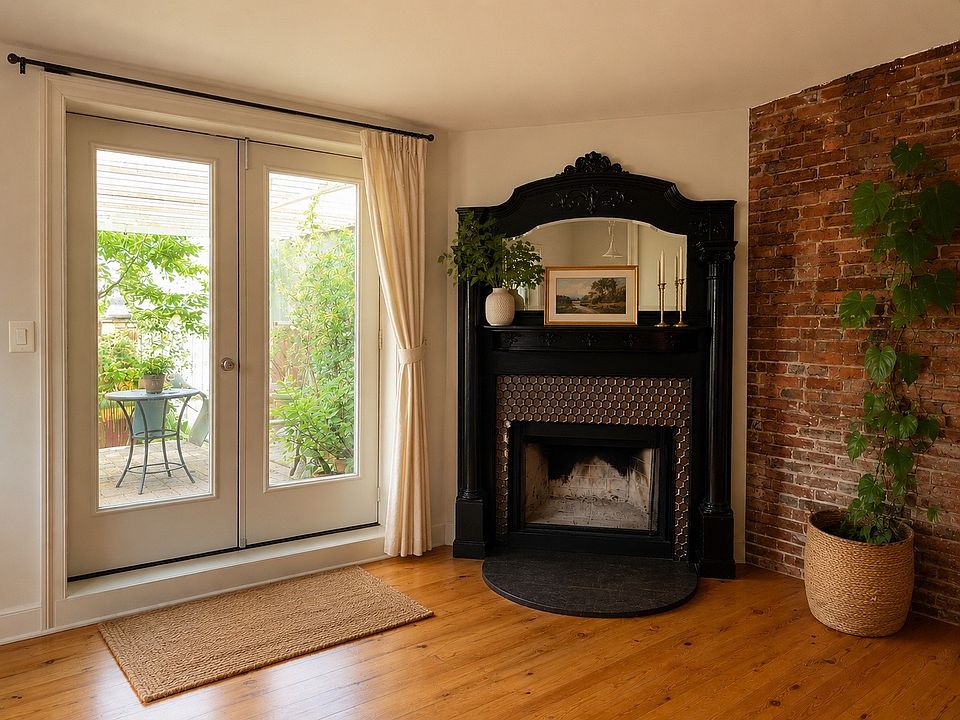 Wood-burning fireplace and French doors to private terrace