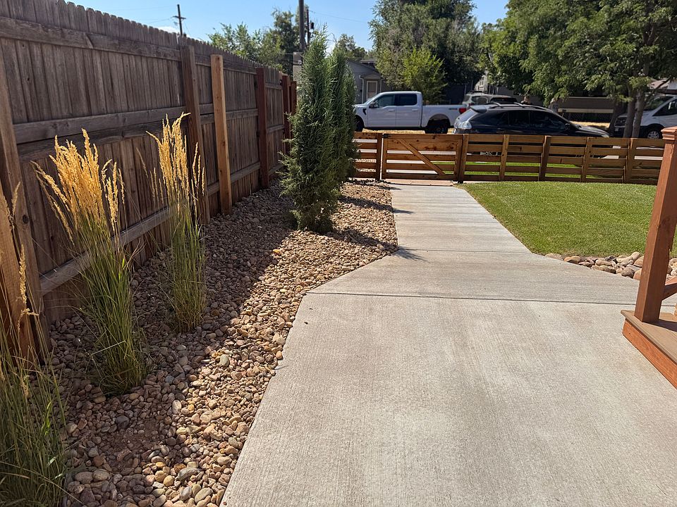Front yard - landscaping and front walkway with gated entry