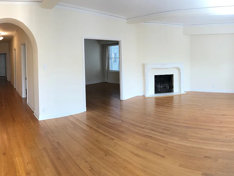 living room, hallway, and partial view of dining room