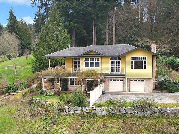 Here you can see the attached two-car garage and garden shed in left-hand corner. This well-built home is calling to you!