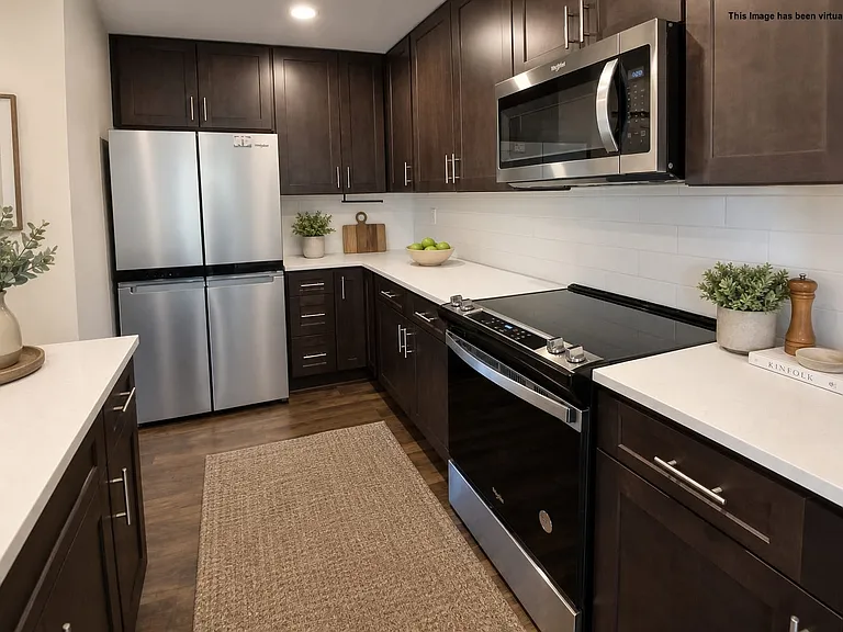 Easy clean flat top range and wood-like floors, virtually staged.