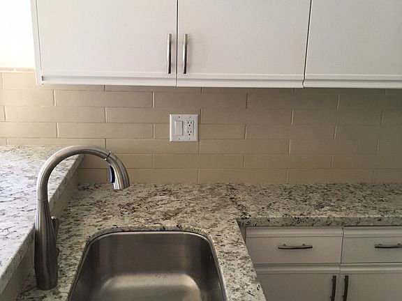 Newly remodeled kitchen with granite countertops, fresh pain
