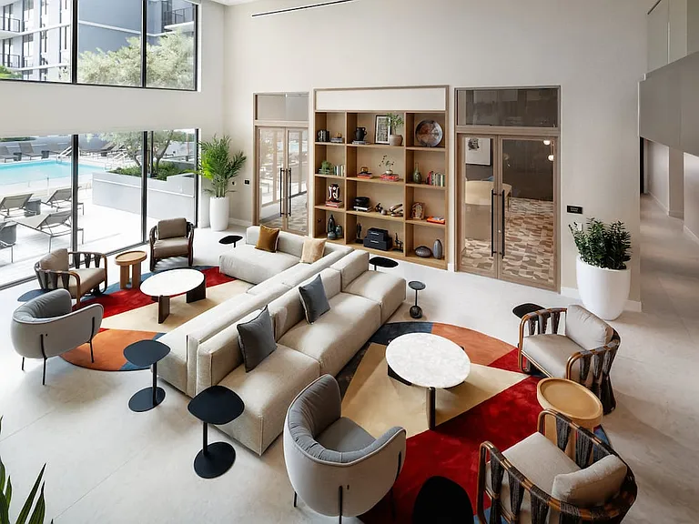 Lower-level resident lounge with multiple seating areas