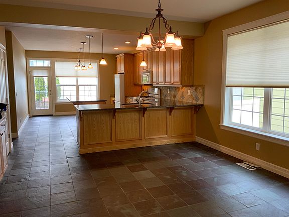 Dining area and kitchen. Great room layout.