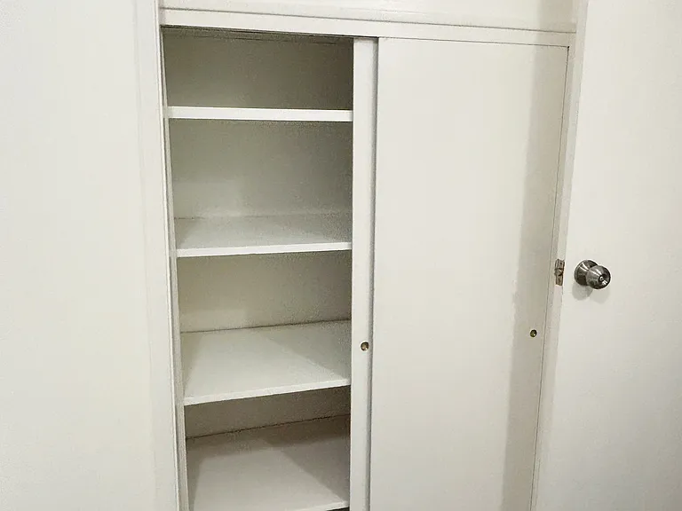 Ample cupboard space in primary bath