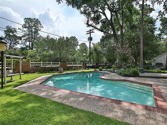 BACK YARD - Plenty of landscaping and grassy area, even with the large pool. Lots of nice features in the back yard to make it feel like home! Notice the built-in swing.