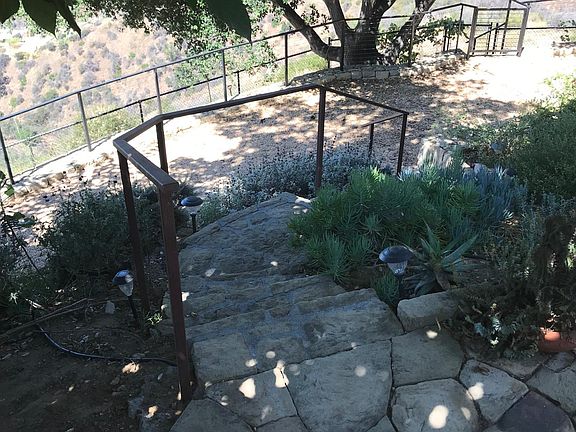 Stairs leading down through garden to private lower 10_x60_ outdoor space