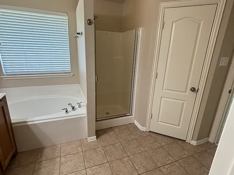 Master Bath: Garden Tub, Shower, Toilet in separate room with door.