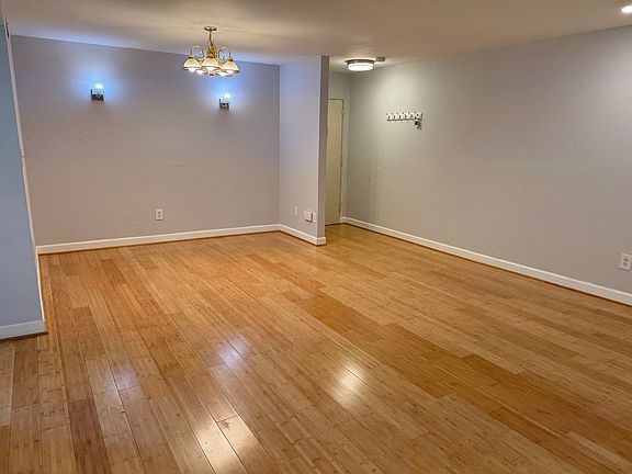 Front door opens to large living room and dining area